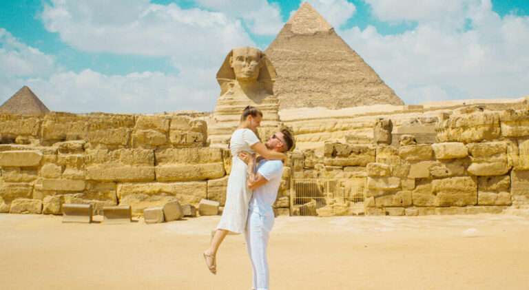 couple in front of pyramid